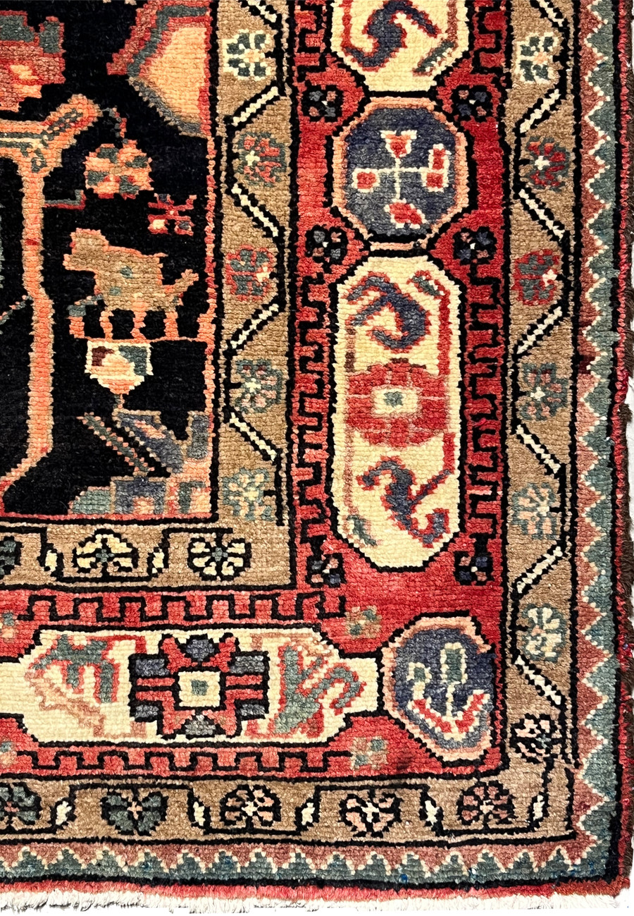 Edge detail of antique Persian Nahavand rug showing sturdy tribal construction, hand-finished sides, and natural wool fibers