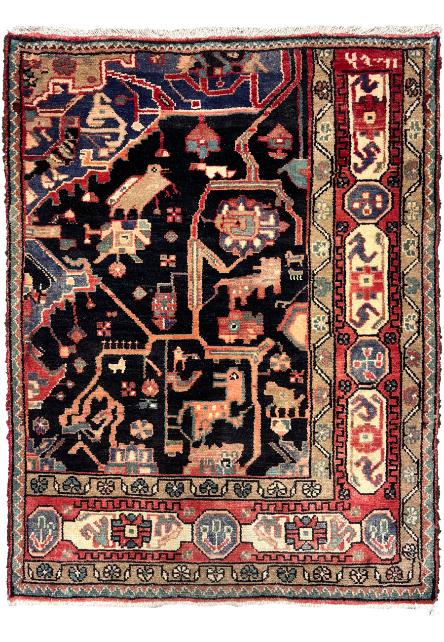Full view of 3x4 antique Persian Nahavand tribal rug with deep indigo field, pictorial animals, geometric compartments, and bold red borders