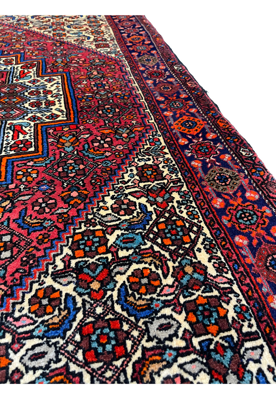 Backside of a Persian Gholtogh rug revealing tight knot structure, even weaving, and craftsmanship quality through visible foundation pattern