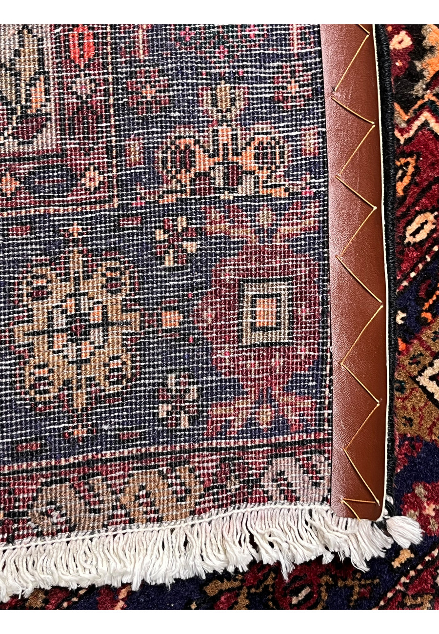 Backside view of a Persian Gholtogh rug revealing tight knot density, clear tribal pattern visibility, strong foundation, and traditional village weaving