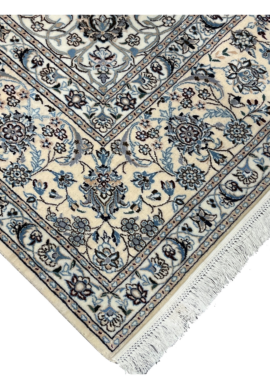 Edge and fringe detail of Persian Nain Habibian silk rug showing clean finishing, silk foundation, and even knot alignment