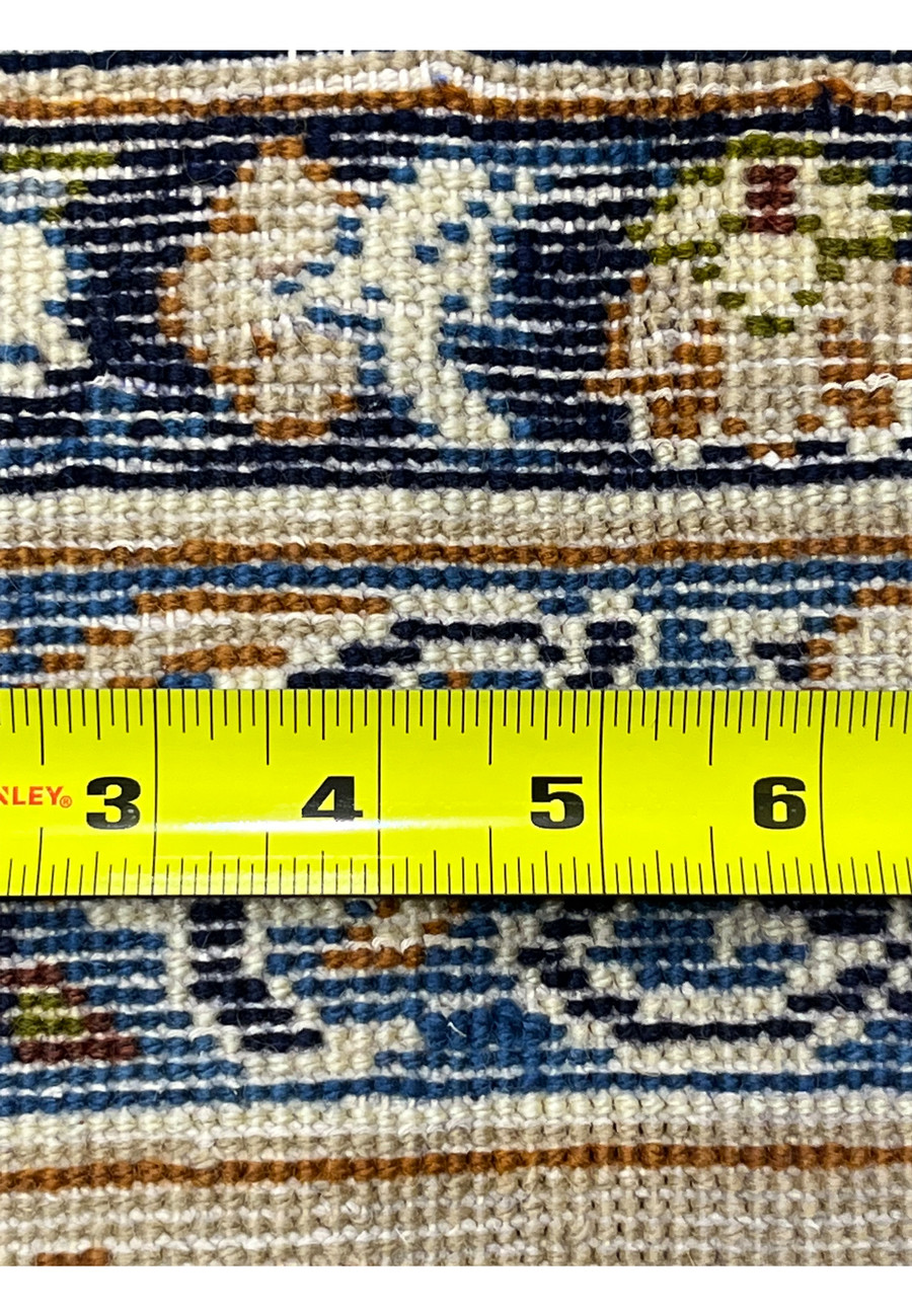 Backside of Persian Kashan rug with ruler showing fine knot density tight weave structure navy and ivory wool foundation detail