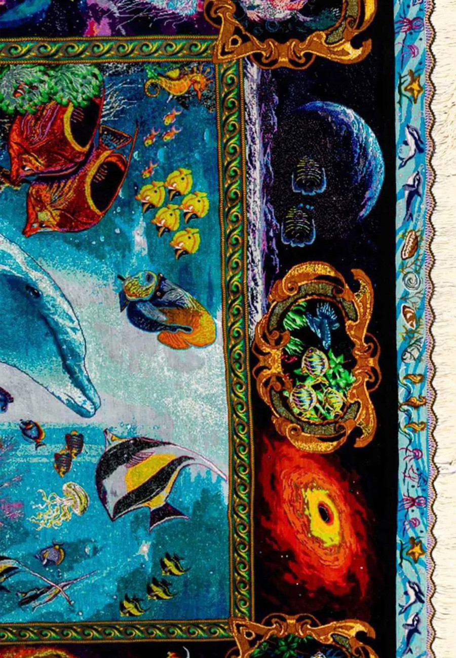 Ornate gold scroll border of Persian Qum silk dolphin ocean rug featuring celestial galaxy motifs