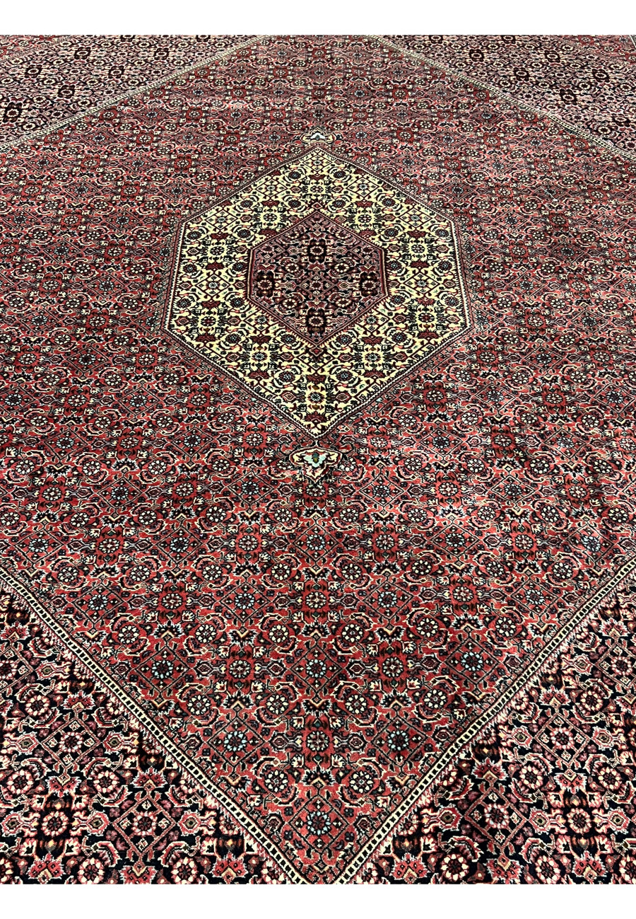 Midfield close up of Persian Bijar Iron Rug 8'2 x 11'4 with dense Herati pattern, brick red ground and intricate geometric detailing