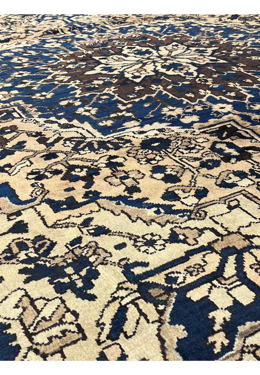 Pattern detail of large 11x13'3 Vintage Persian Heriz rug showing navy blue medallion fragments, ivory field and aged earthy tones.