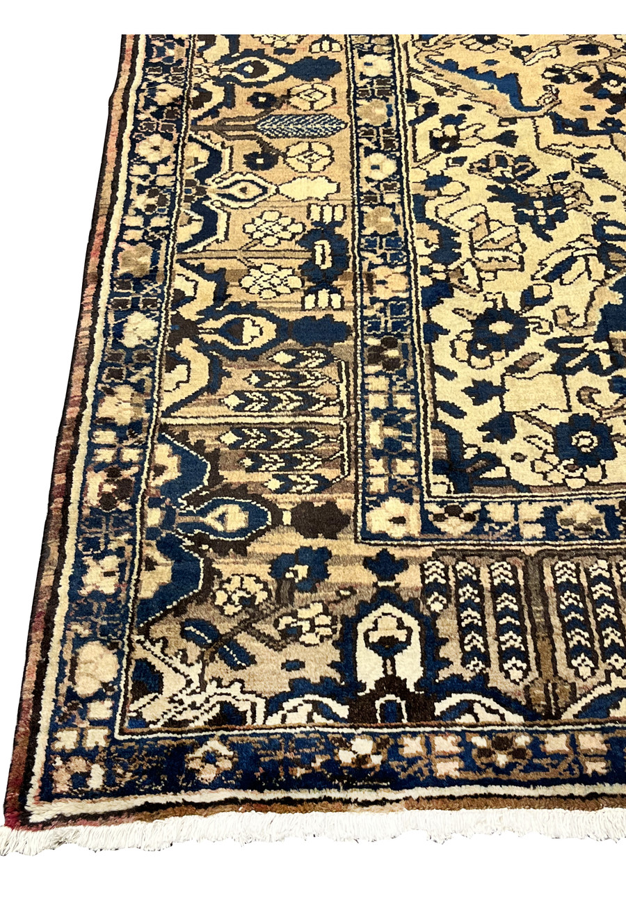 11x13'3 Vintage Persian Heriz rug border view featuring navy blue, ivory and warm brown geometric tribal patterns and classic angular design.