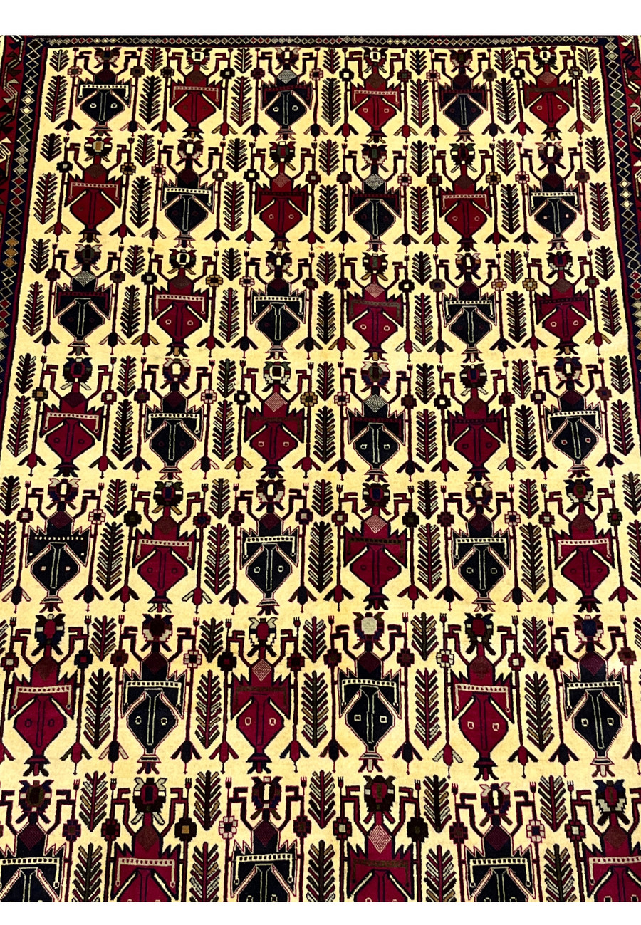 Midfield detail of 5x8 Persian Afshar rug showing allover boteh and vase motifs on ivory ground