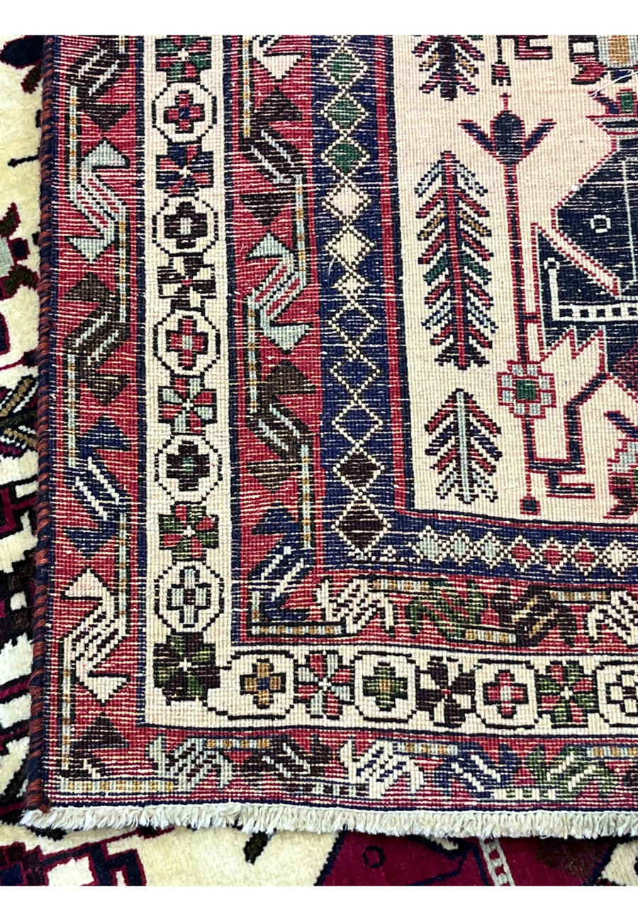 Back of 5x8 Persian Afshar tribal rug showing hand-knotted wool construction and knot density