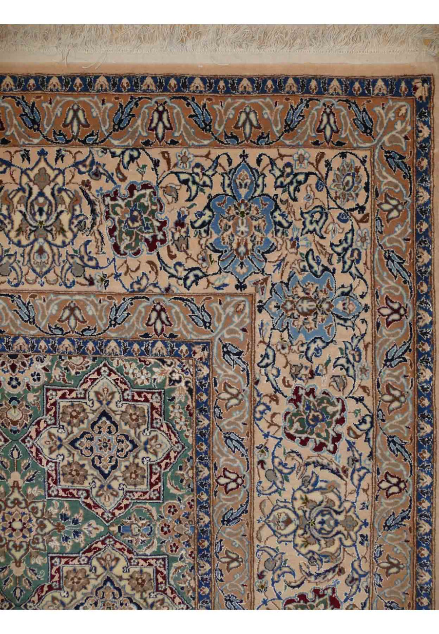 Border and corner detail of the 6'8 x 10'1 Persian Nain 6 LAA Habibian rug showing the Shah Abbasi palmette border design with layered guard borders and intricate floral vine work in indigo and ivory