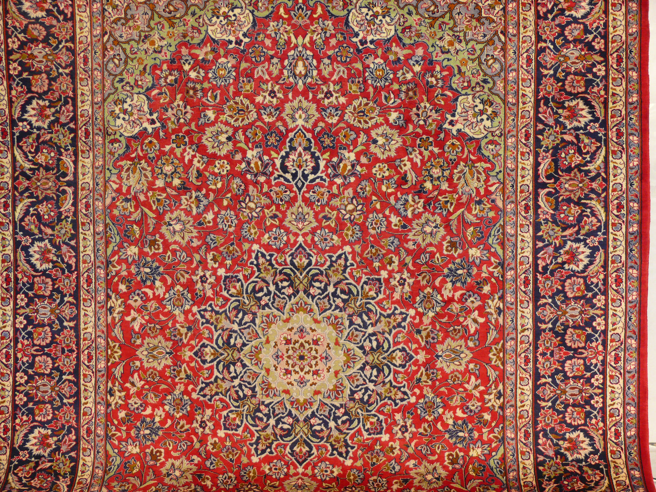 Centerpiece Detail - Persian Isfahan Rug Medallion: Get lost in the mesmerizing intricacies of the medallion at the heart of this 9'8 x 13'7 Persian Isfahan rug, a testament to masterful craftsmanship