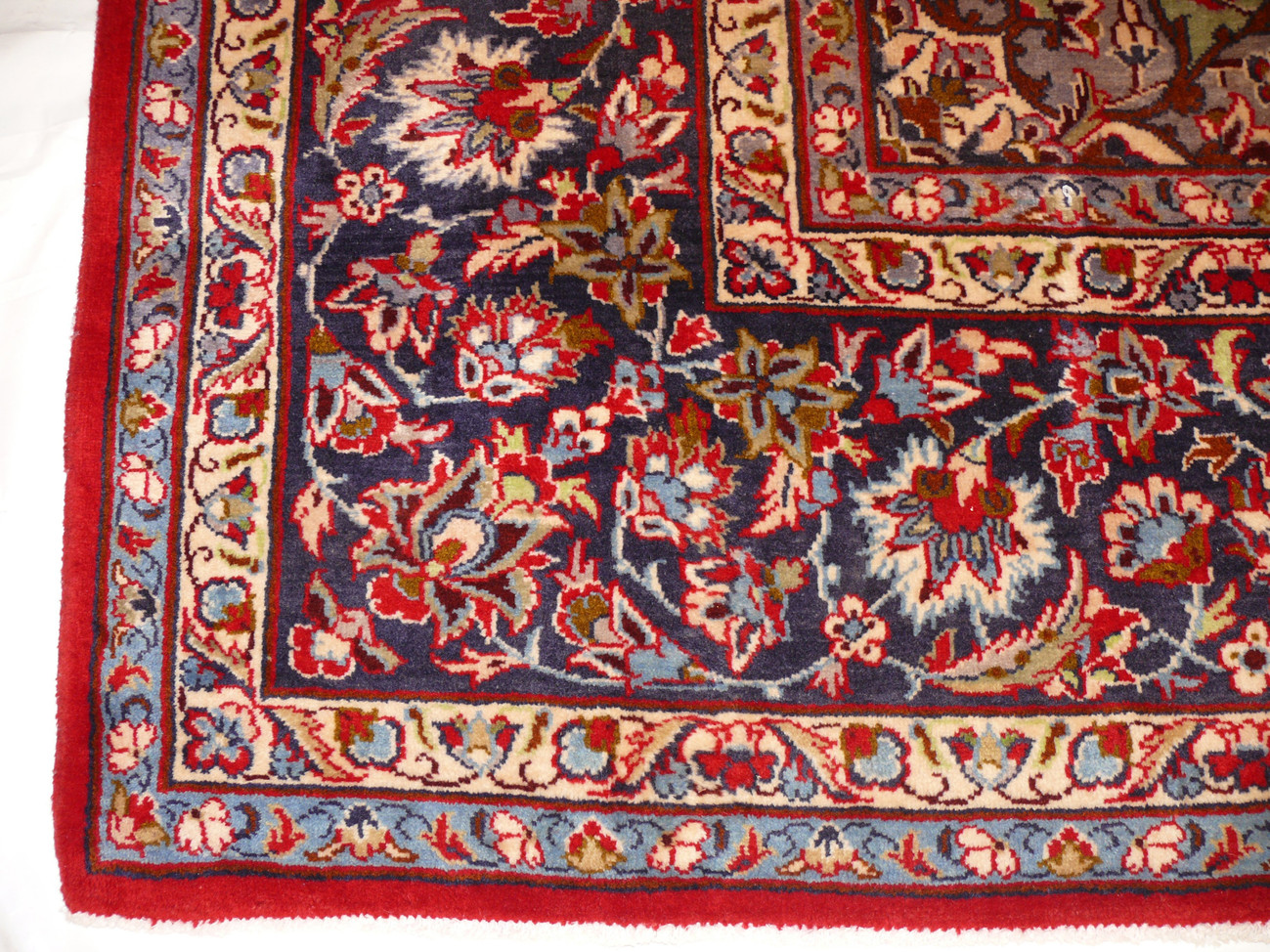 Border Elegance - Persian Isfahan Rug Border: Admire the detailed border of this 9'8 x 13'7 Persian Isfahan rug, a testament to the rug maker's dedication to perfection