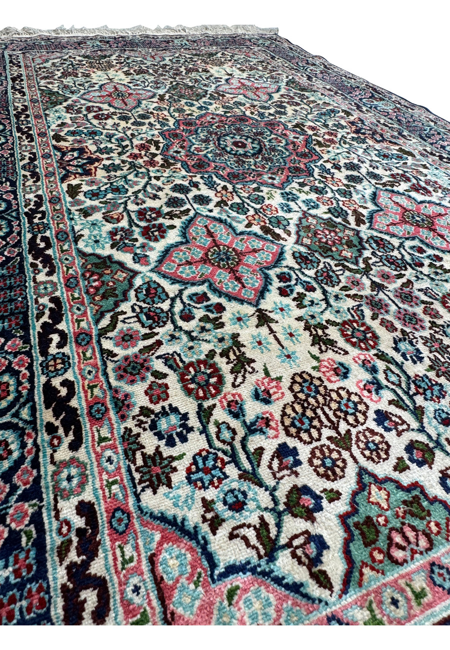 Side view of a 3 x 5 Persian Qum Silk Rug, displaying the texture and intricate weaving.