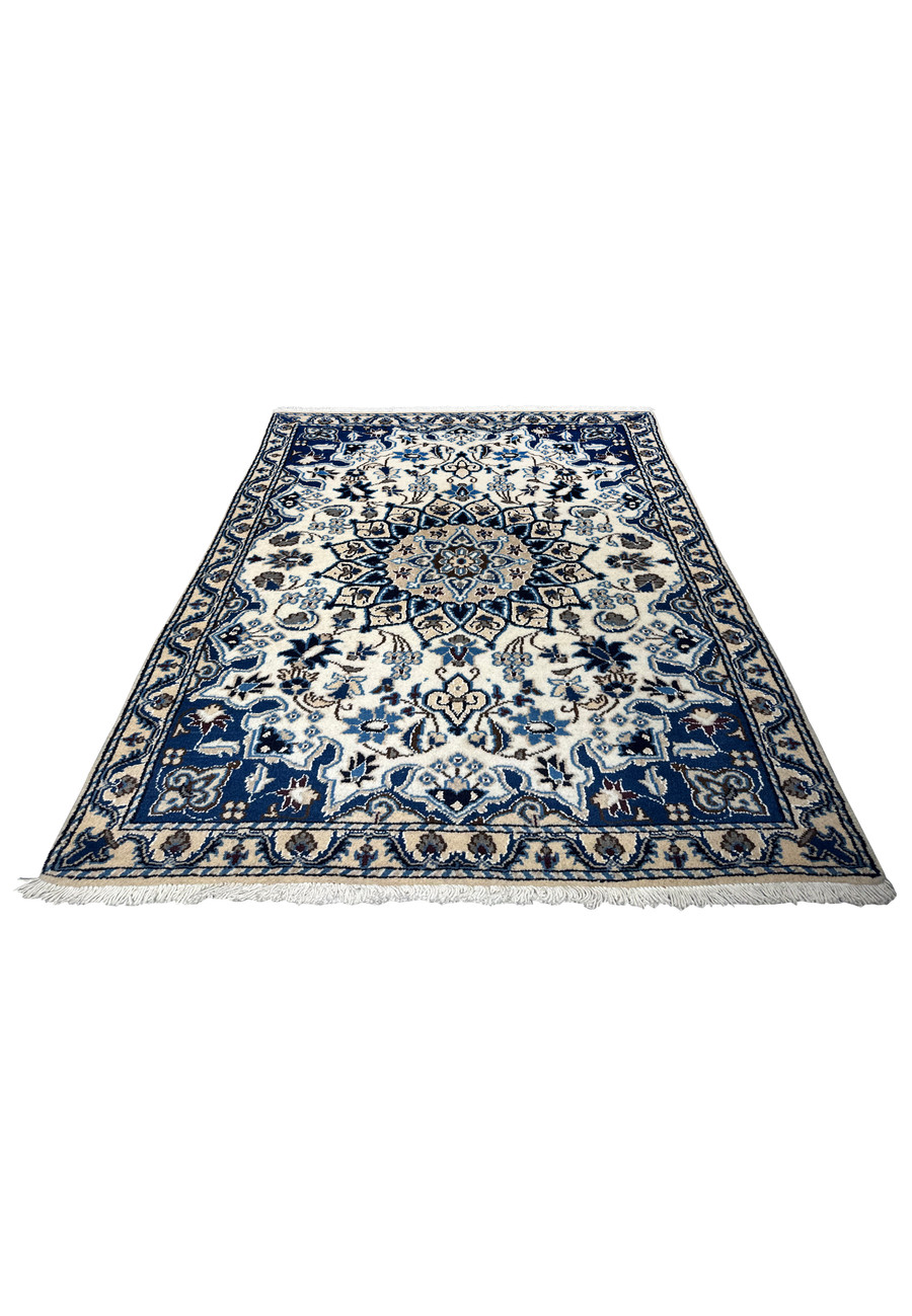 Laid-down 2'11" x 4'6" Persian Nain rug showing intricate floral motifs.