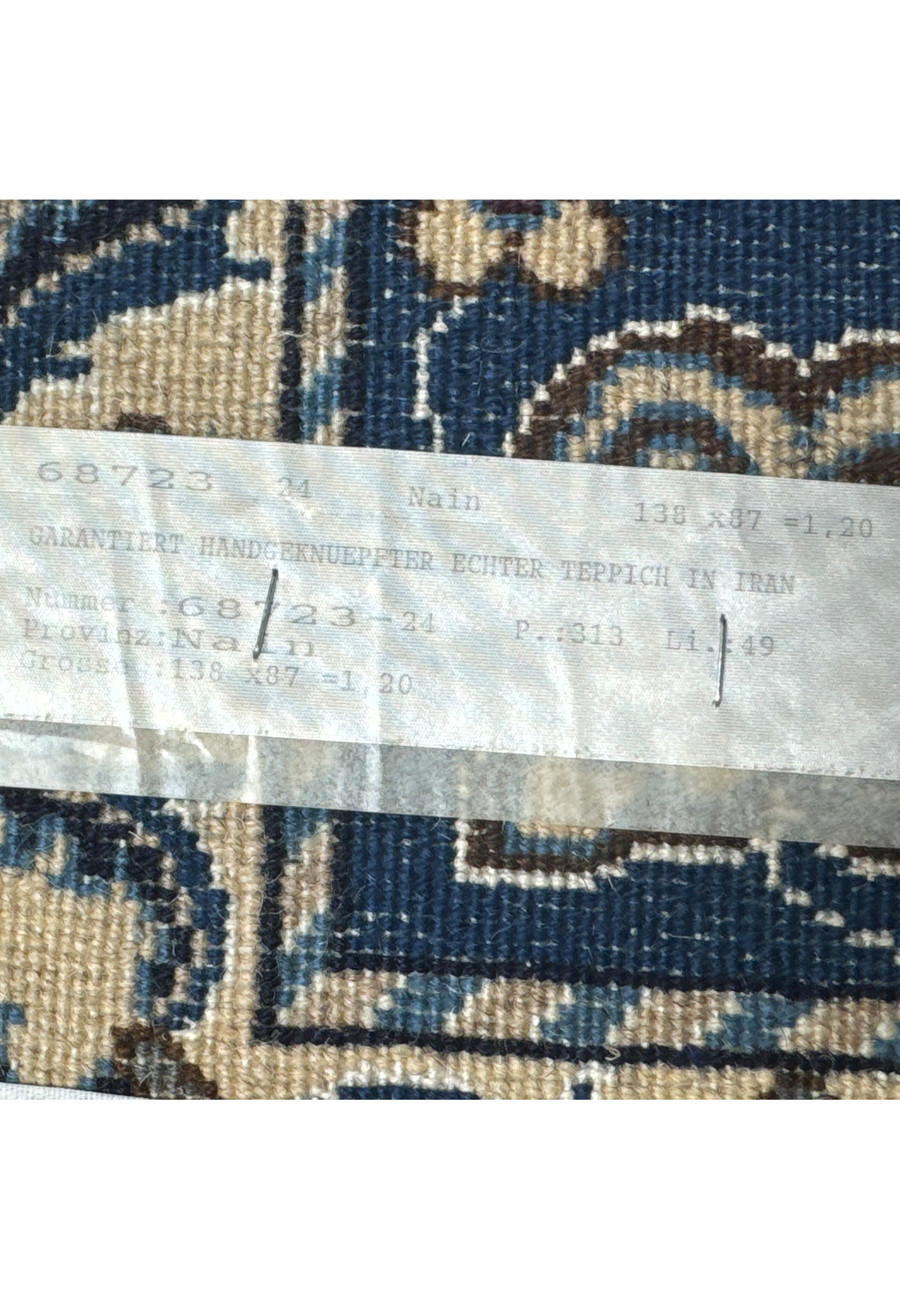 Rug tag displaying authenticity of 2'11" x 4'6" Persian Nain rug.