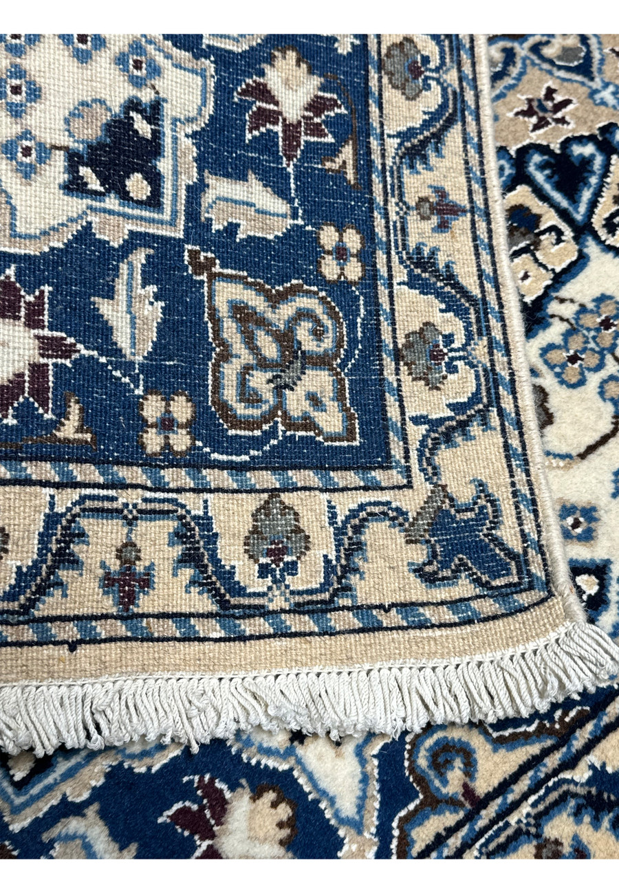 Backside of Persian Nain rug showing hand-knotted craftsmanship.