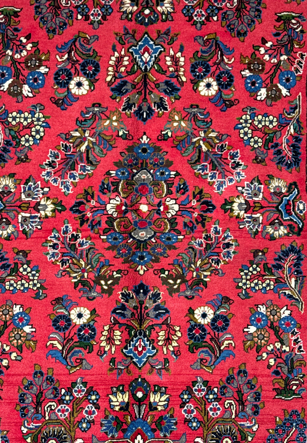 This is an image of a 4 x 7 Persian Sarough rug featuring intricate floral patterns with a rich color palette of deep reds, navy blues, and touches of white, beige, and lighter blues. The design includes a symmetrical arrangement of detailed blossoms and foliage with a prominent central medallion and densely decorated border, characteristic of traditional Persian craftsmanship