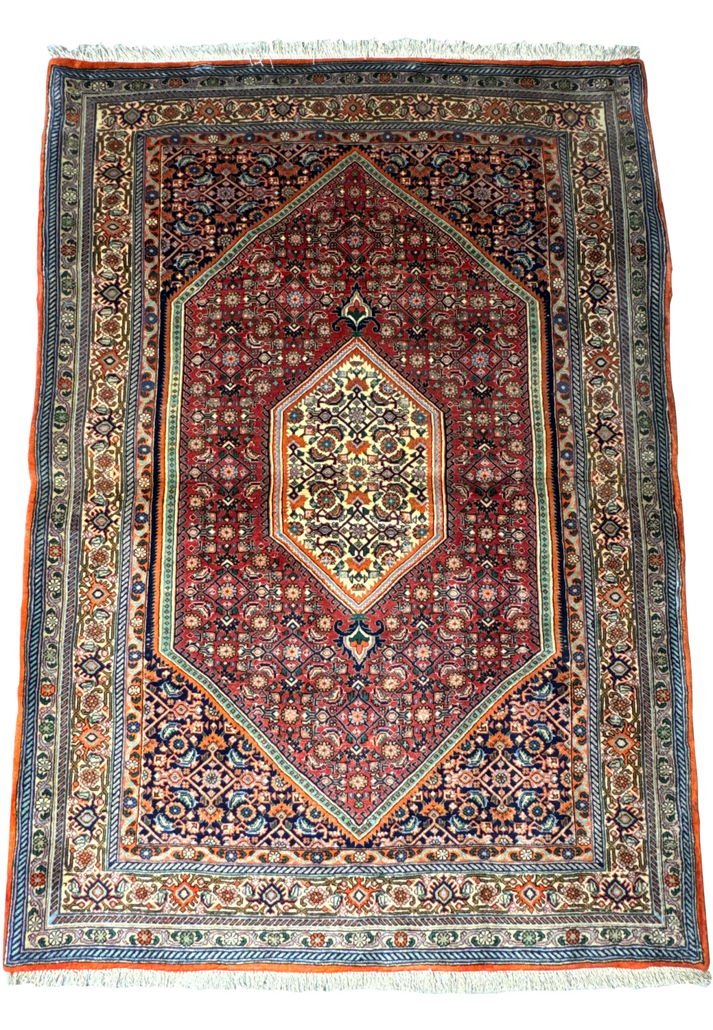 A detailed image of a Persian Bijar rug laid flat, showcasing the central medallion design with a red background and intricate floral patterns in indigo, ivory, and orange hues