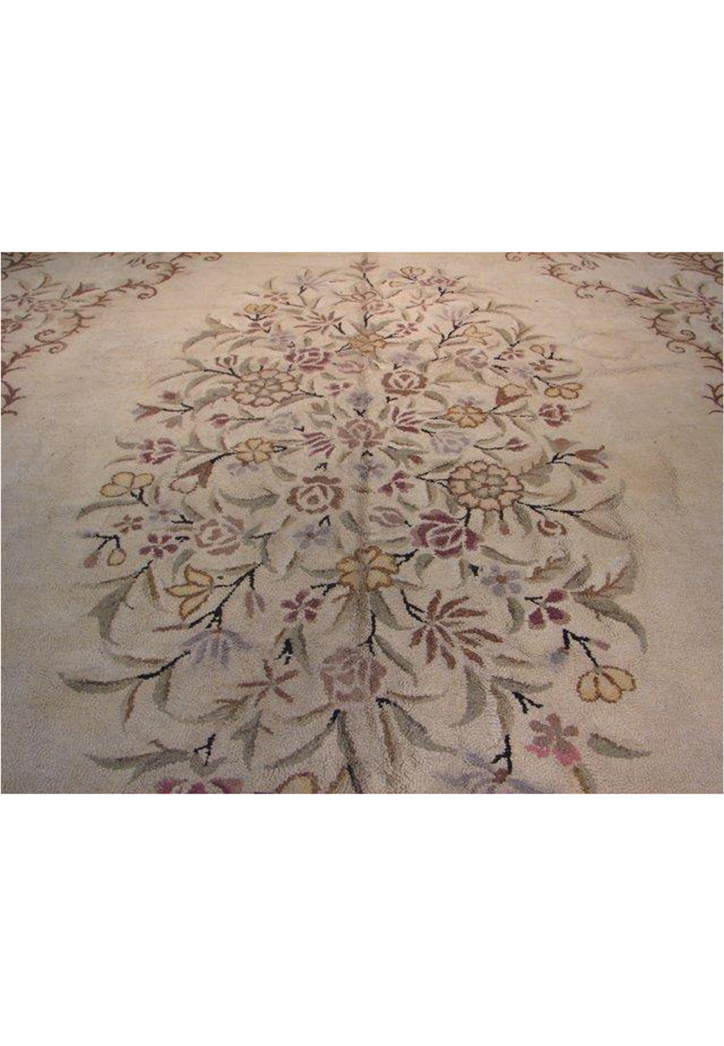 Detailed craftsmanship on a large 11'3" x 17'10" Persian Aubusson-style oval rug with intricate border and soft color desig