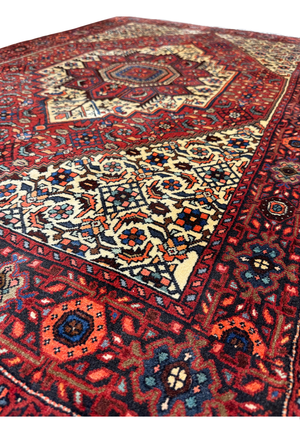 Angle shot highlighting the plush pile and vivid colors of the Persian Gholtogh rug