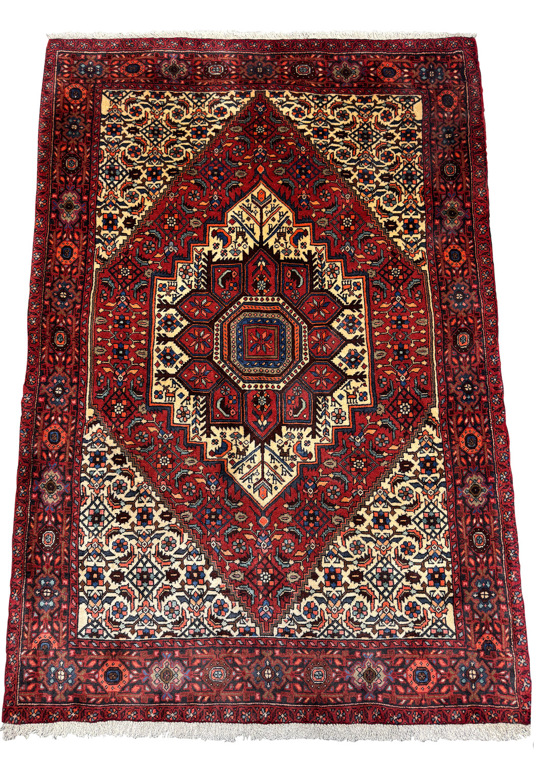 Full rug view of Persian Gholtogh displaying intricate border and rich color palette