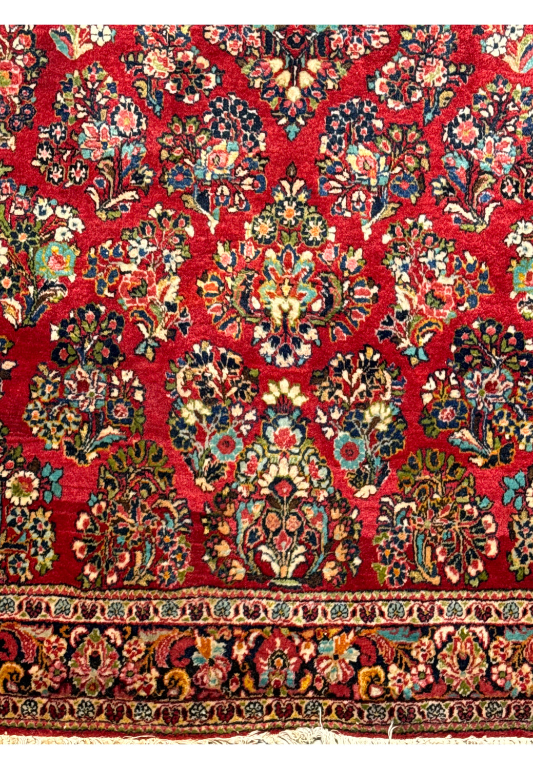 Close-up of the central medallion on the Persian Sarough rug, with a detailed look at the complex patterns and color variations