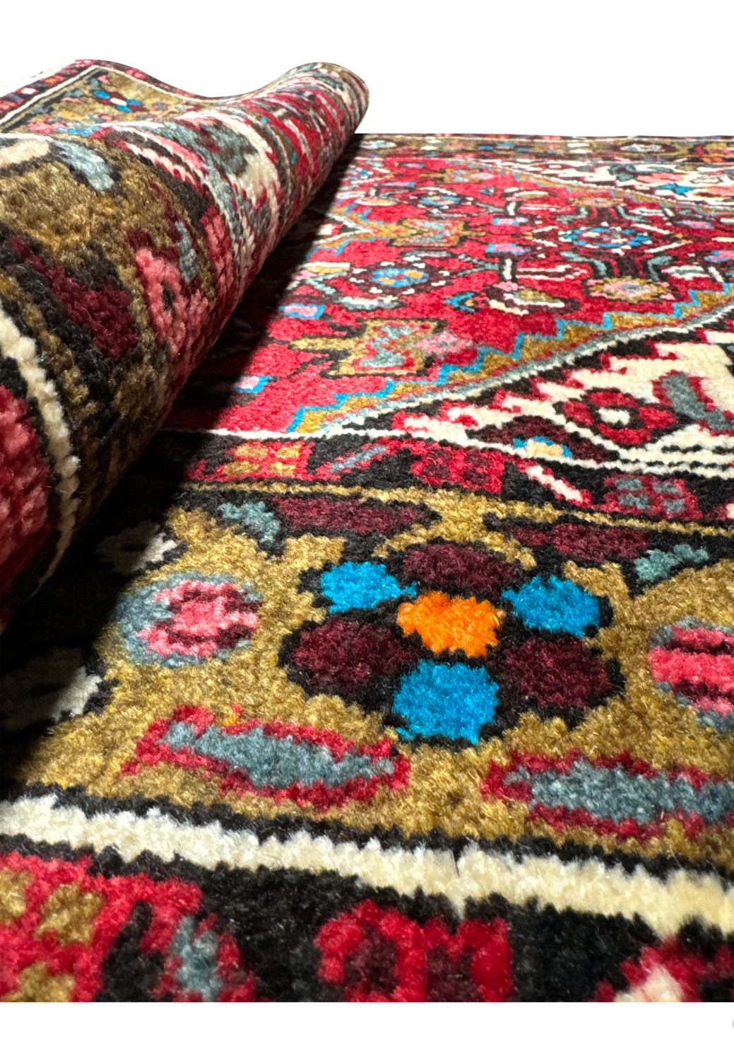 Elevated view of the Persian Hamedan rug showing the textural depth and detailed motifs