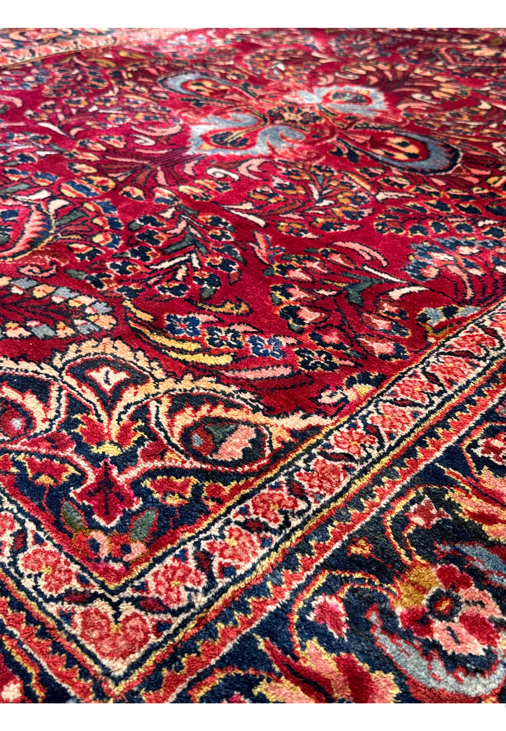 Angled shot of a 4x7 Antique Persian Lilihan Rug displaying the intricate weave and color harmony.