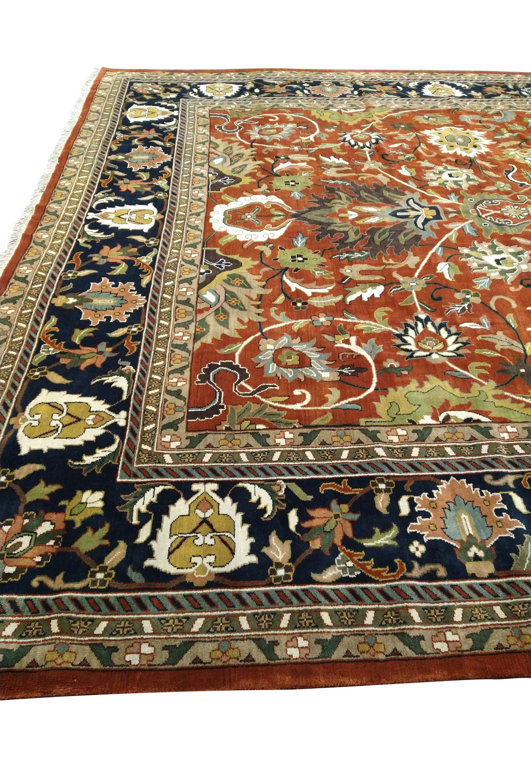 Detailed view of the elaborate border and corner designs of a handwoven Oriental Serapi Palace Rug with navy blue and terracotta hues
