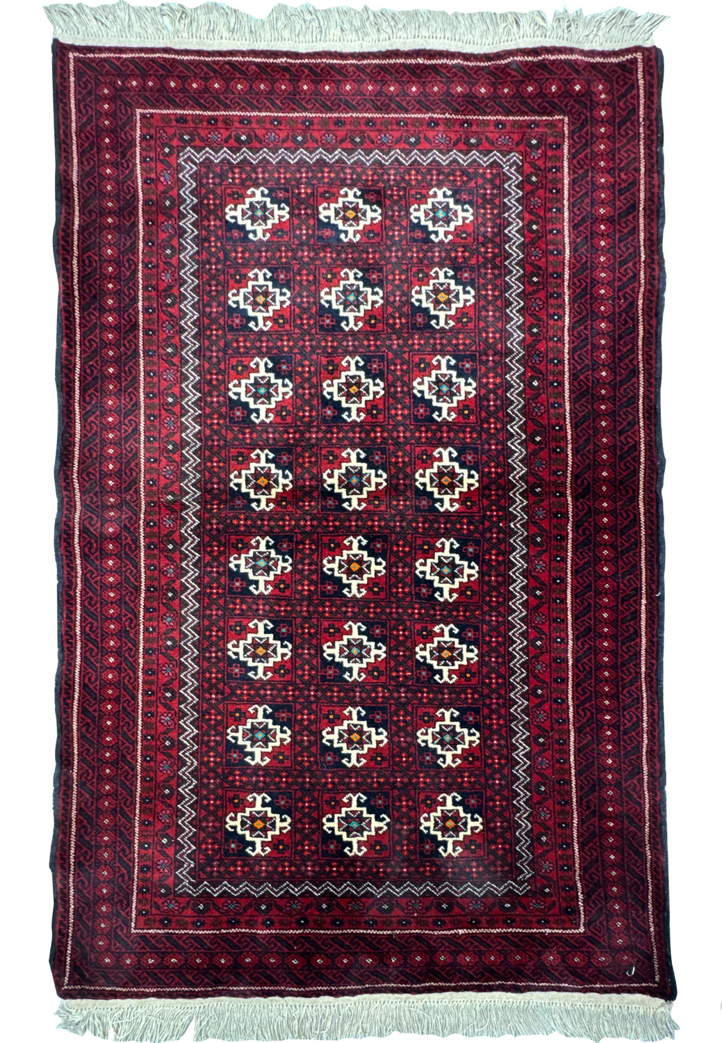 Antique Persian Baluch rug with dark red background and geometric diamond lattice pattern featuring navy blue, white, and orange accents