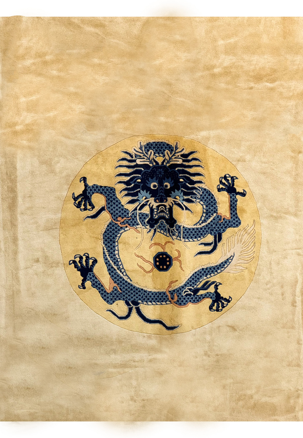 Close-up of the central dragon motif on a Chinese Beijing Dragon Rug, showcasing intricate details and vibrant colors