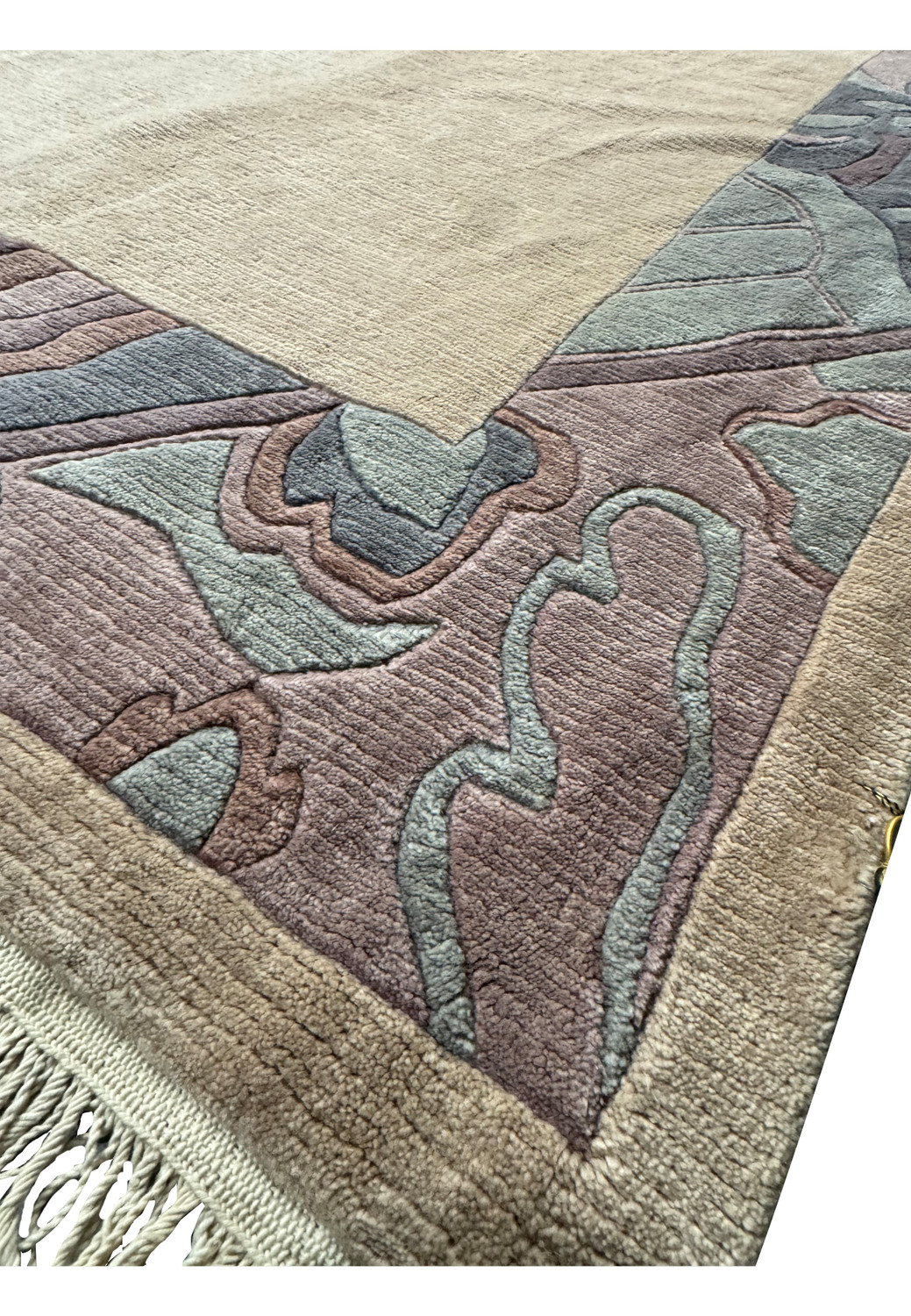 Close-up of the Modern Royal Tibetan rug's fringe and border pattern.