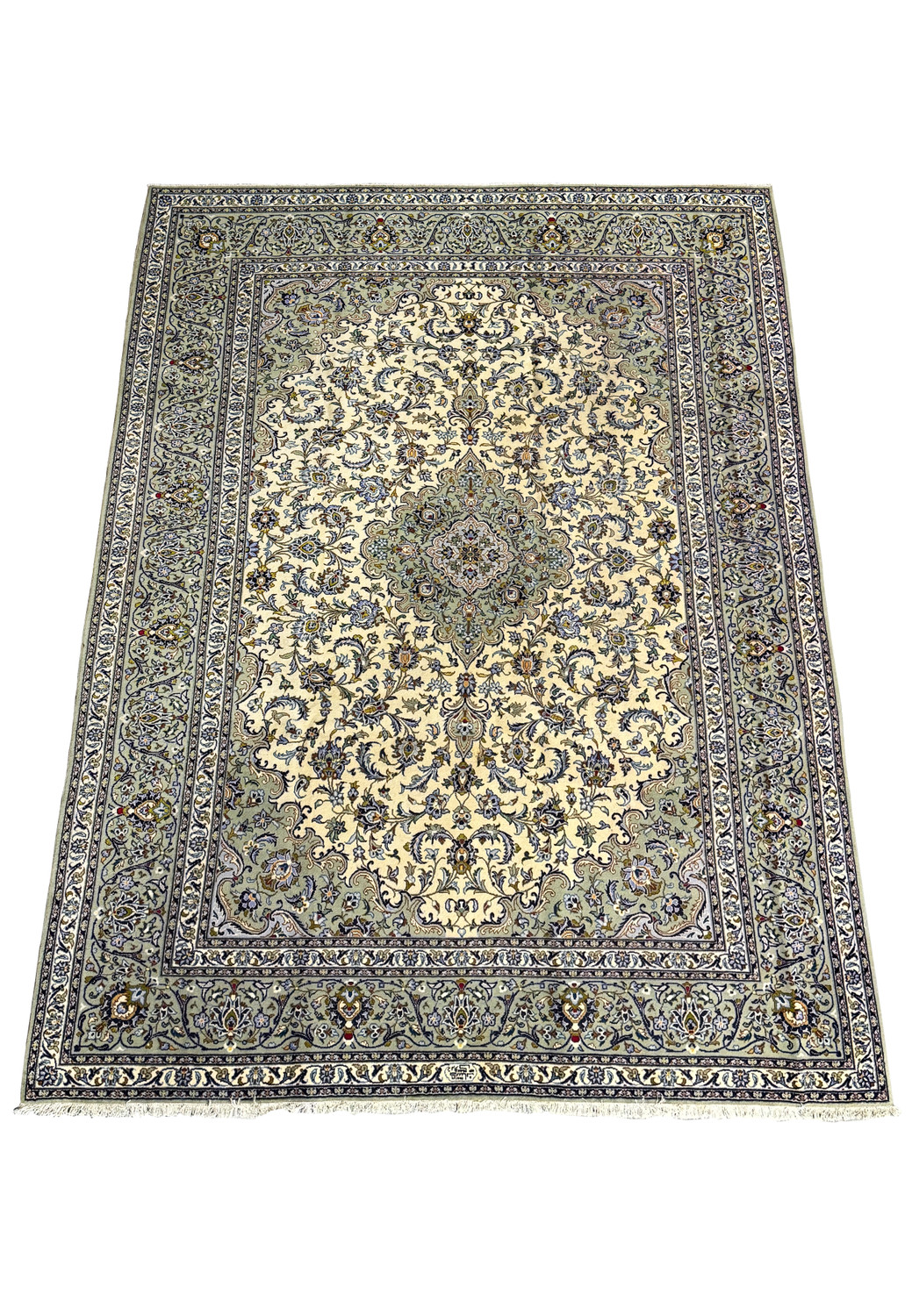 9x12 Persian Kashan rug displayed on the floor, showing intricate patterns and a dominant cream field surrounded by detailed borders