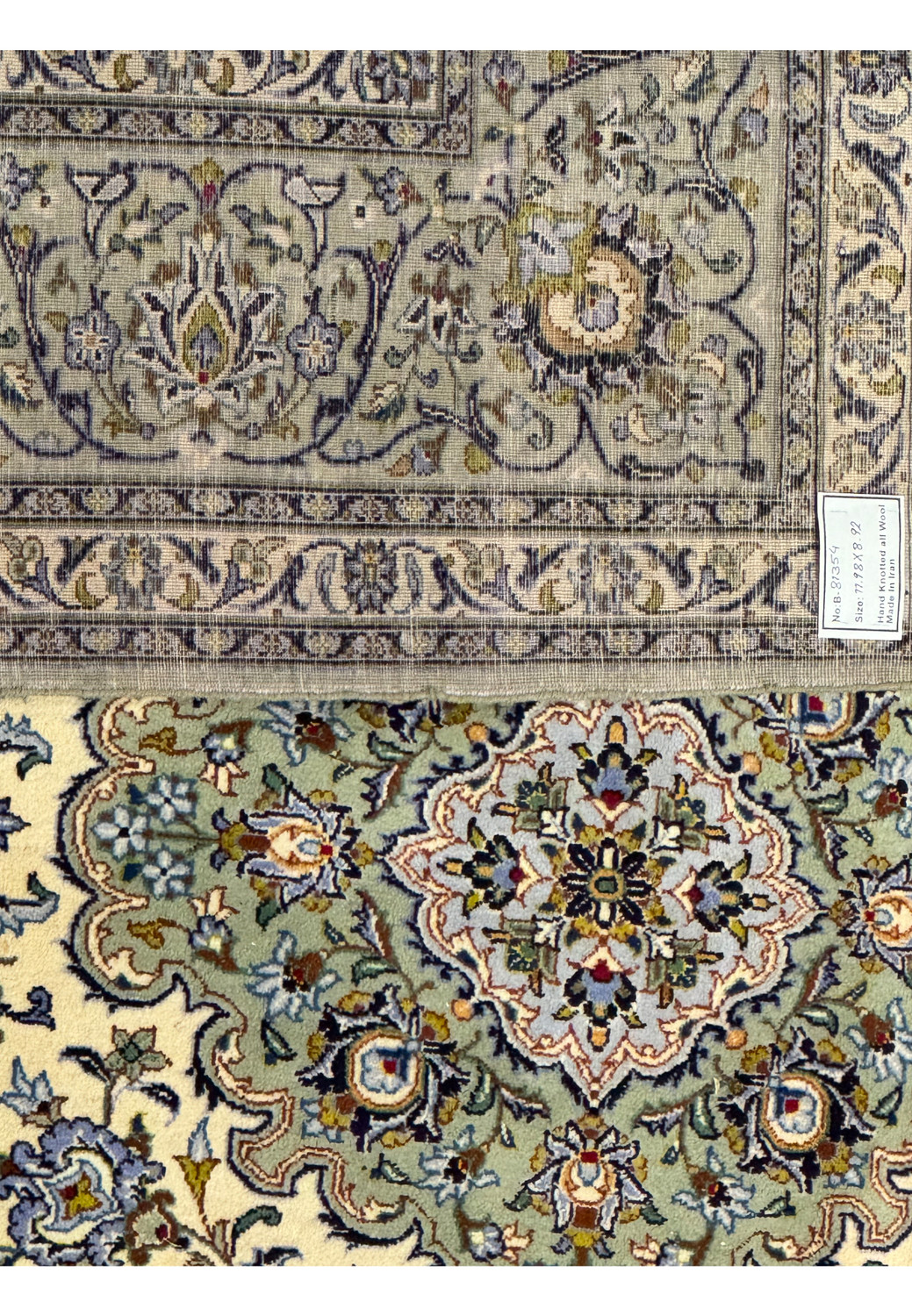 The back of the a 9x12 Persian Ivory Kashan Rug showcasing the weaving artistry.