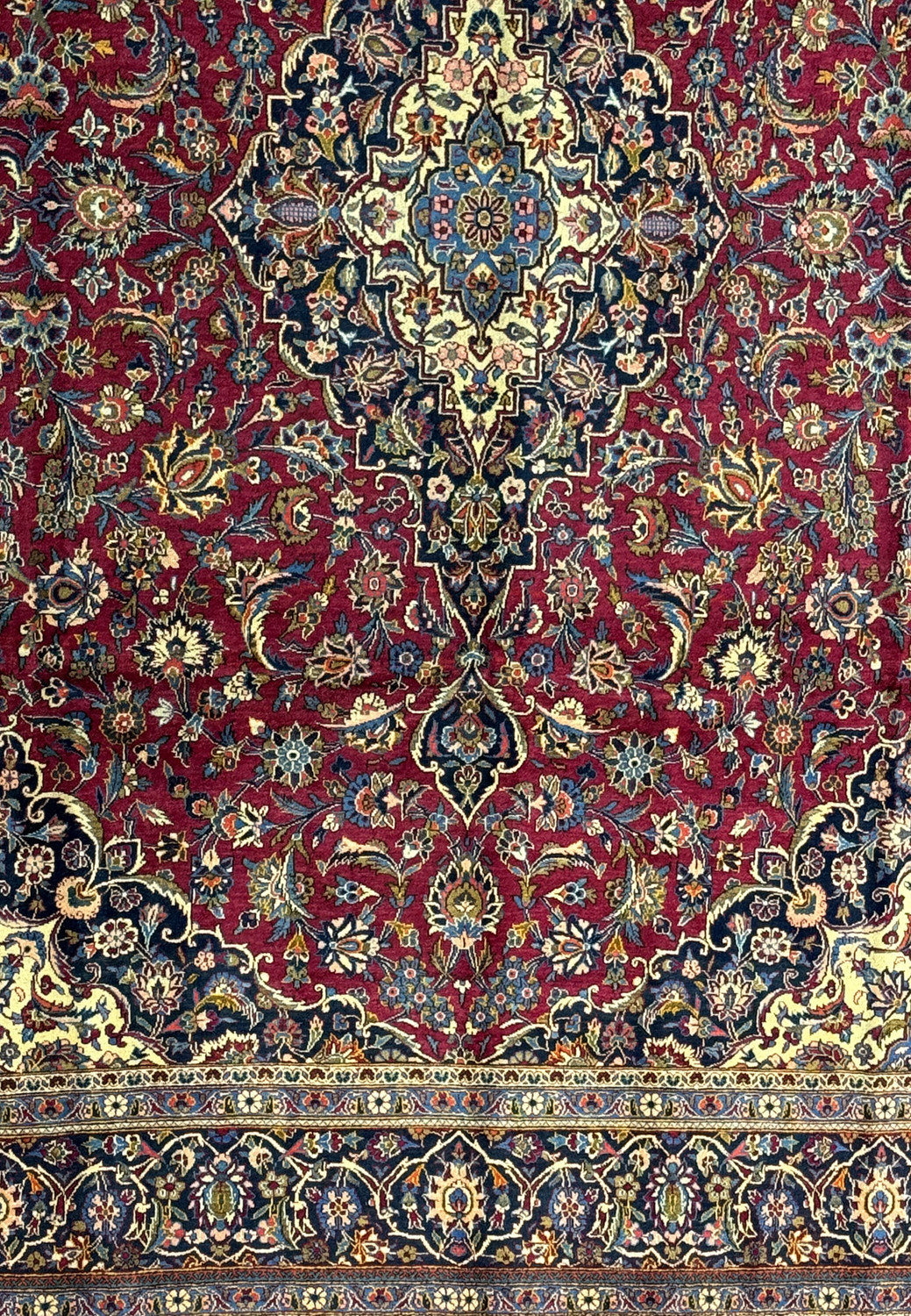 Magnified view of the Persian Kashan rug's pattern work, displaying the expert craftsmanship and varied color scheme