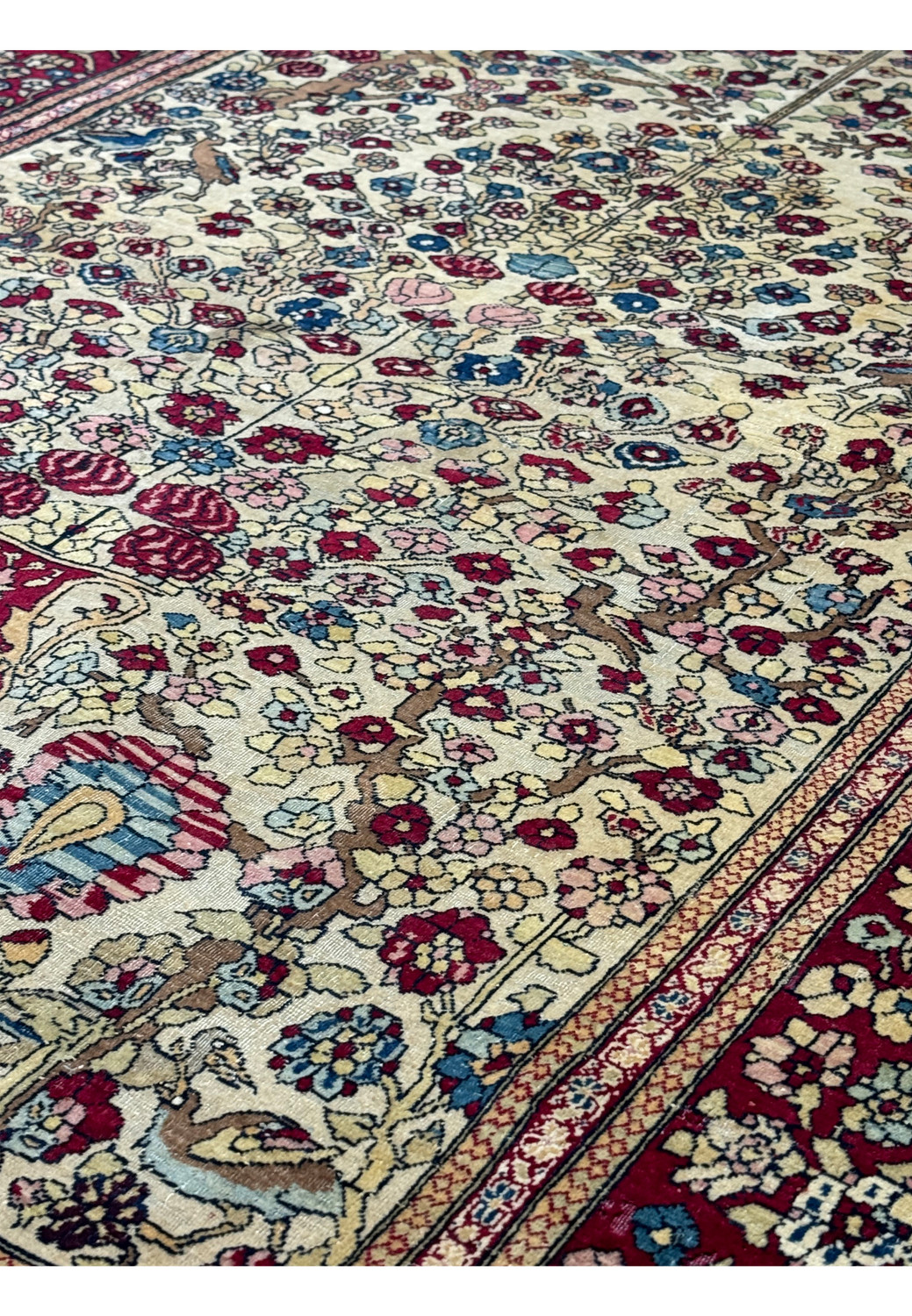 A side view of the rug, focusing on the edge to show the rug's thickness and the quality of its weave.