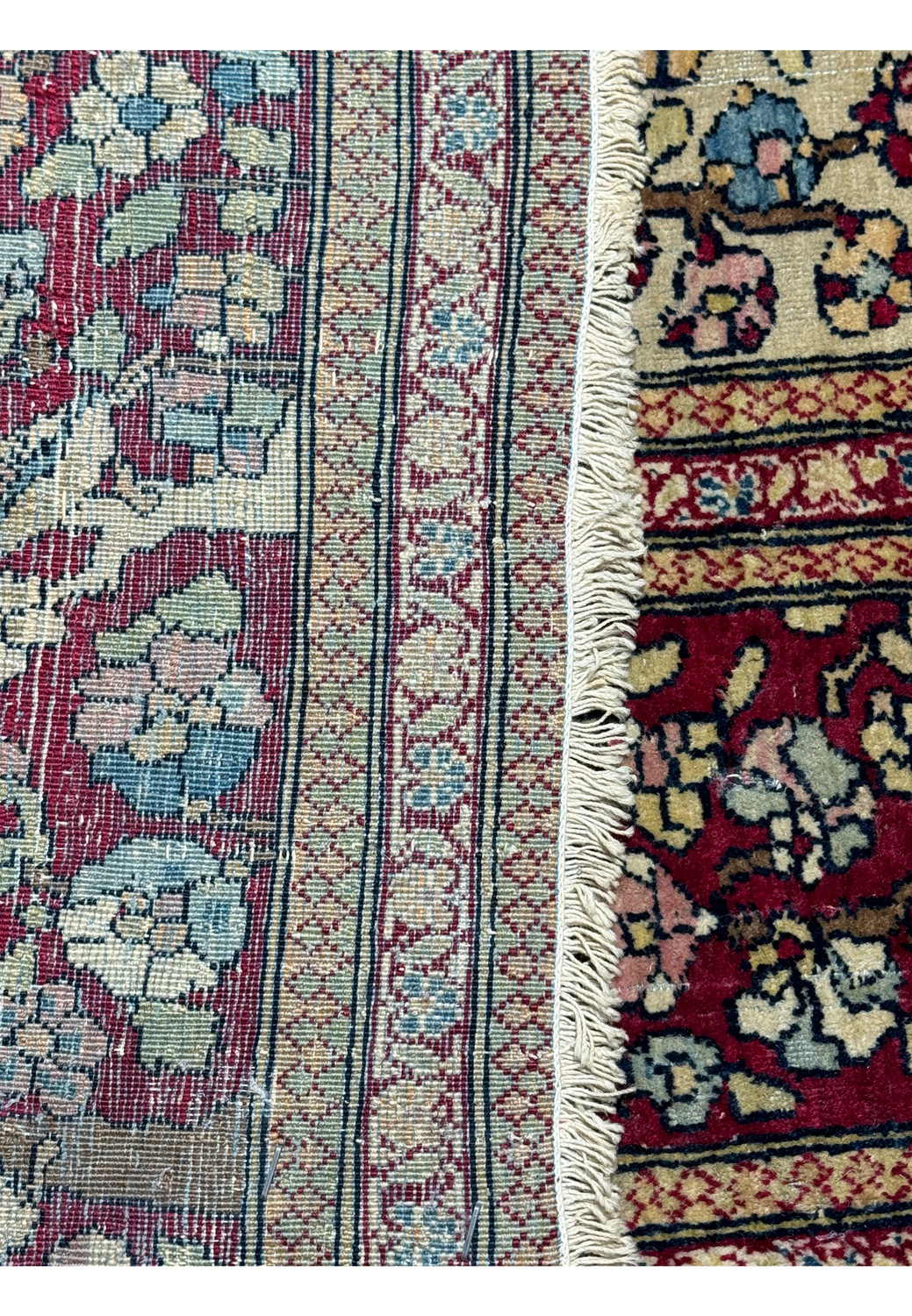 The underside of the rug, displaying the tightness of the weave and the rug's overall structural integrity.