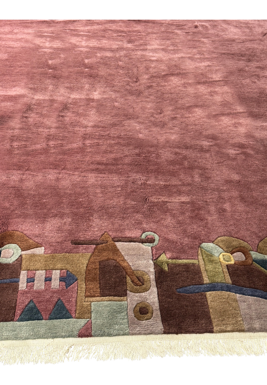 Corner detail of plush modern Tibet rug displaying fine weaving and fringe