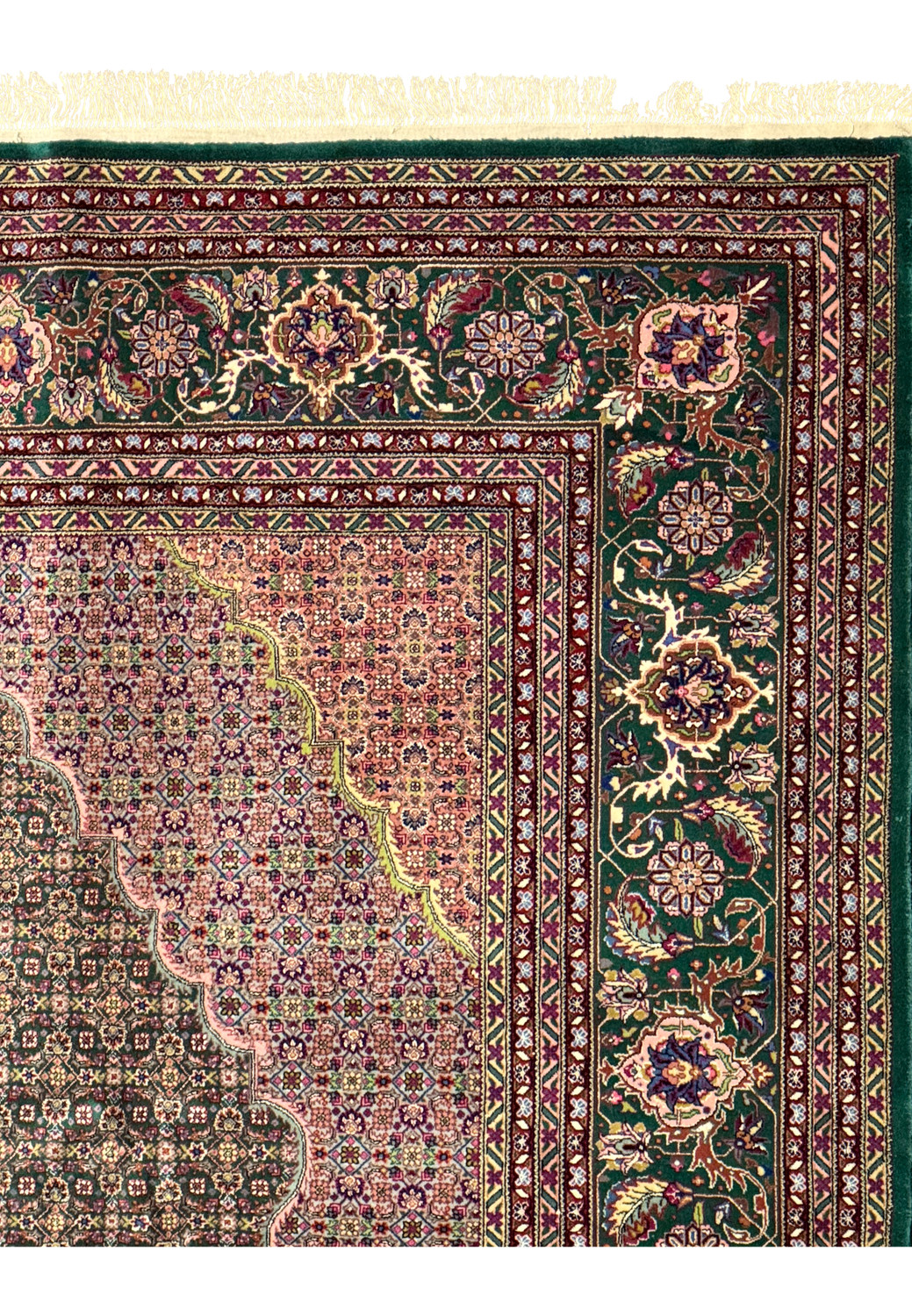 Full view of a Persian Tabriz rug showcasing the Mahi design and ornate borders
