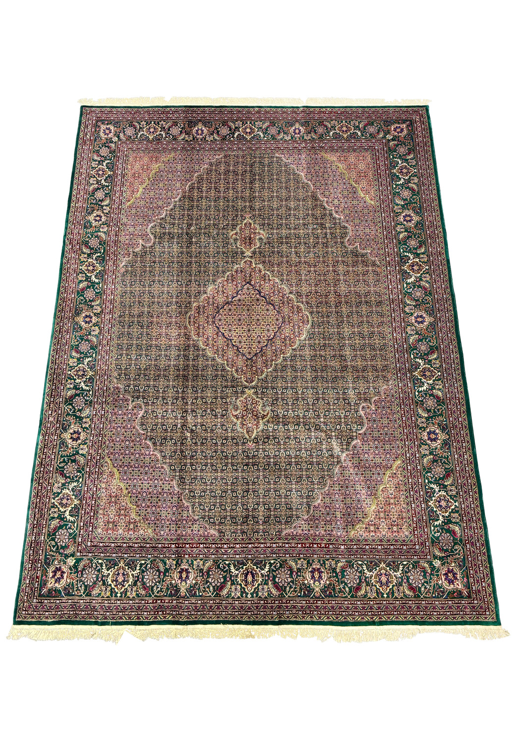 Luxurious Persian Tabriz wool and silk rug laid out in a spacious room