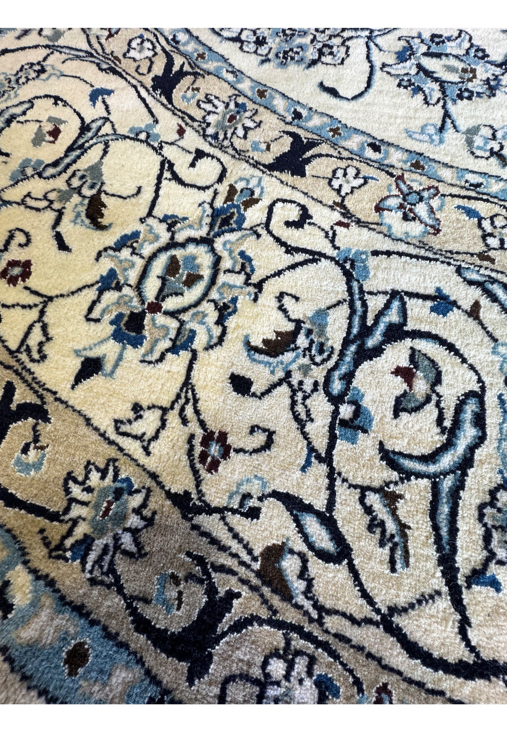 Zoomed-in view of the Persian Nain Round Rug's back demonstrating the fine handwoven knots and quality craftsmanship