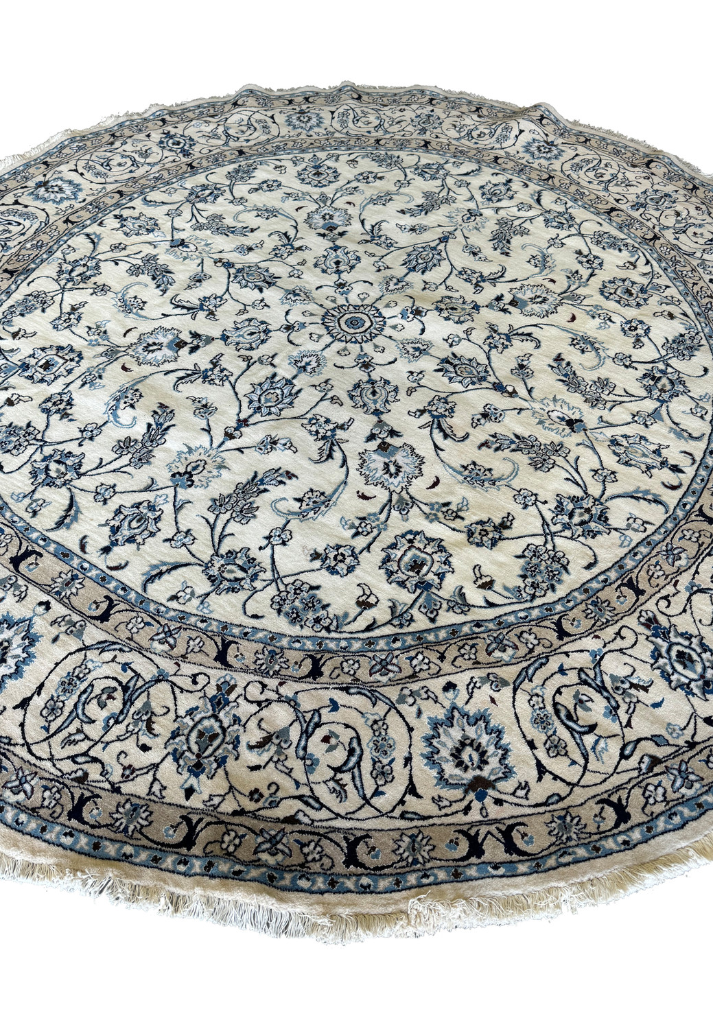Full view of a round Persian Nain rug showcasing detailed border patterns