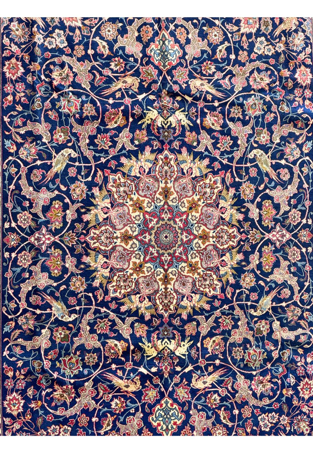 Zoomed-in view of the central medallion of the Persian Isfahan rug, showcasing the intricate design and silk accents