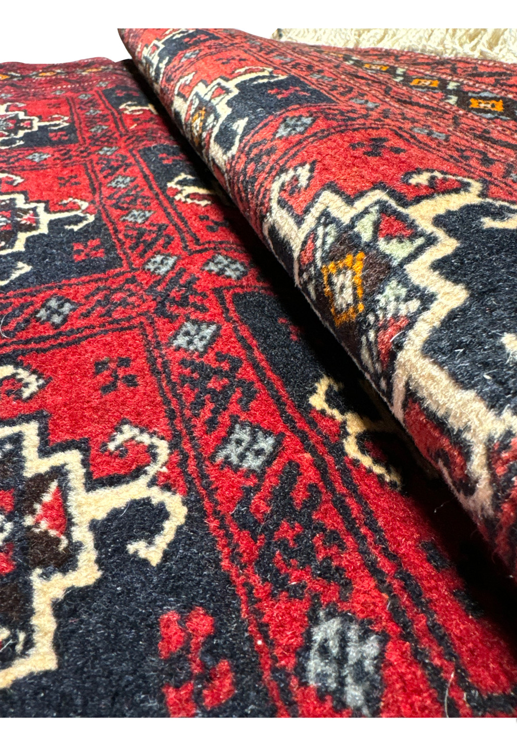 Angled close-up showcasing the rug's texture and weave, emphasizing the quality of the materials and the craftsmanship.