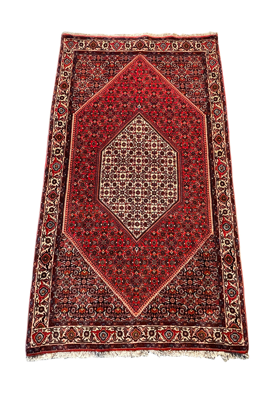 Overhead view of a 4x6 Persian Bijar rug showcasing a central diamond medallion with floral patterns in red, cream, and black hues