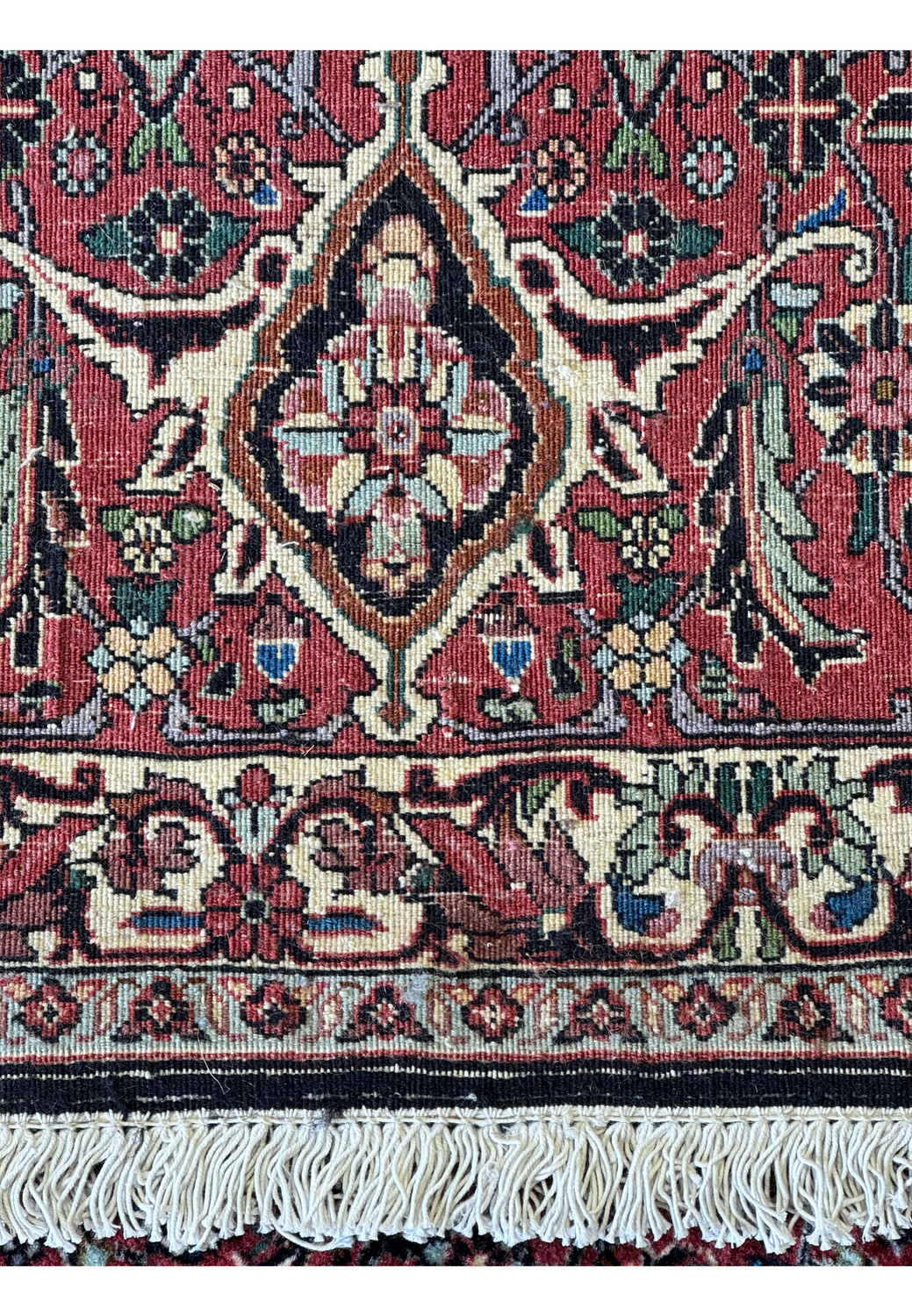 Zoomed-in view of the backside of a Persian Bidjar rug, showcasing the tight weave and exceptional knot quality that contribute to its designation as a high-quality wool rug