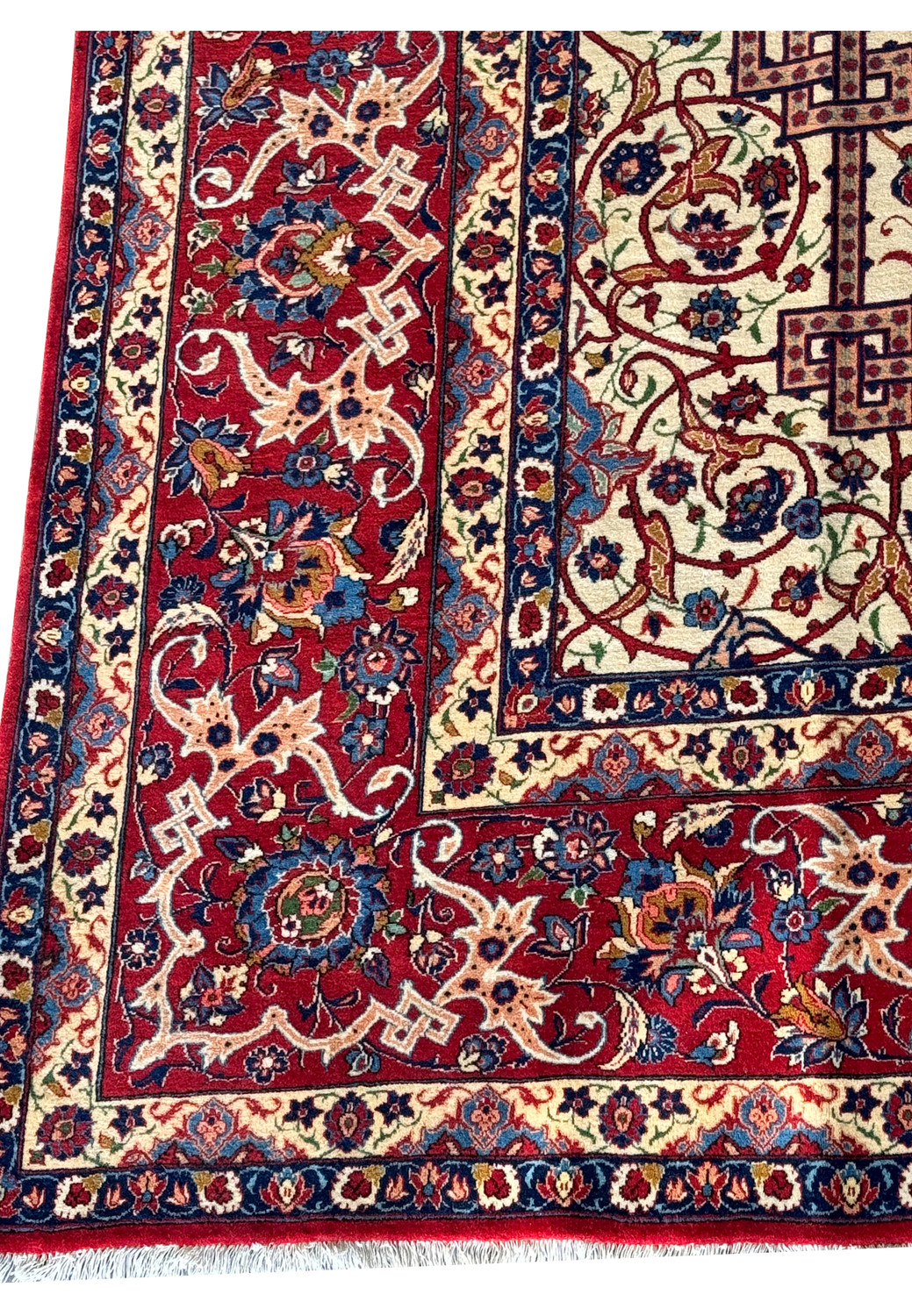 Close-up of the Persian Isfahan rug's edge, focusing on the fine details of the border patterns.