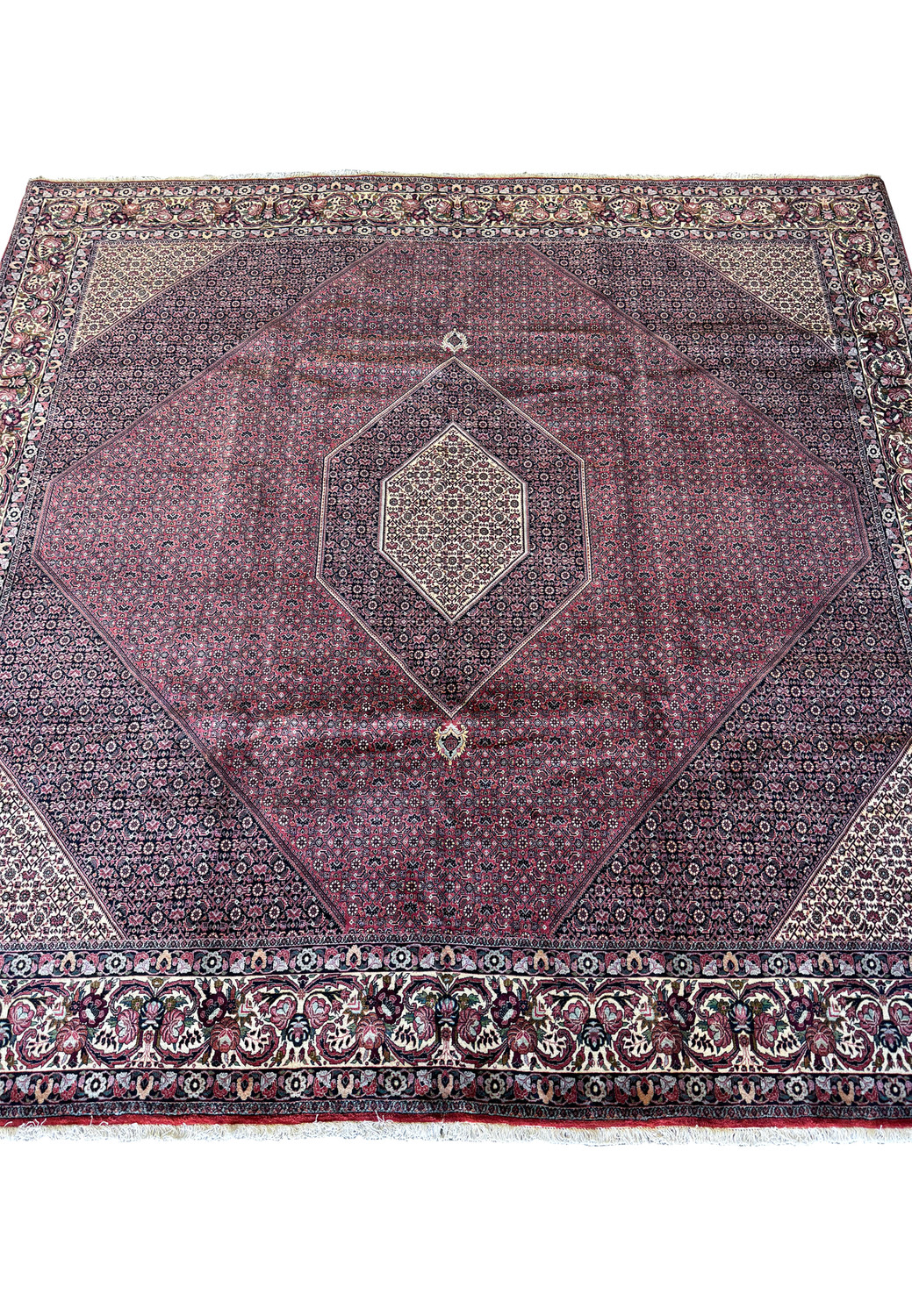 Diagonal view of the 11'6x11'6 Persian Bijar square rug, with a focus on the harmonious integration of central medallion and elaborate border designs