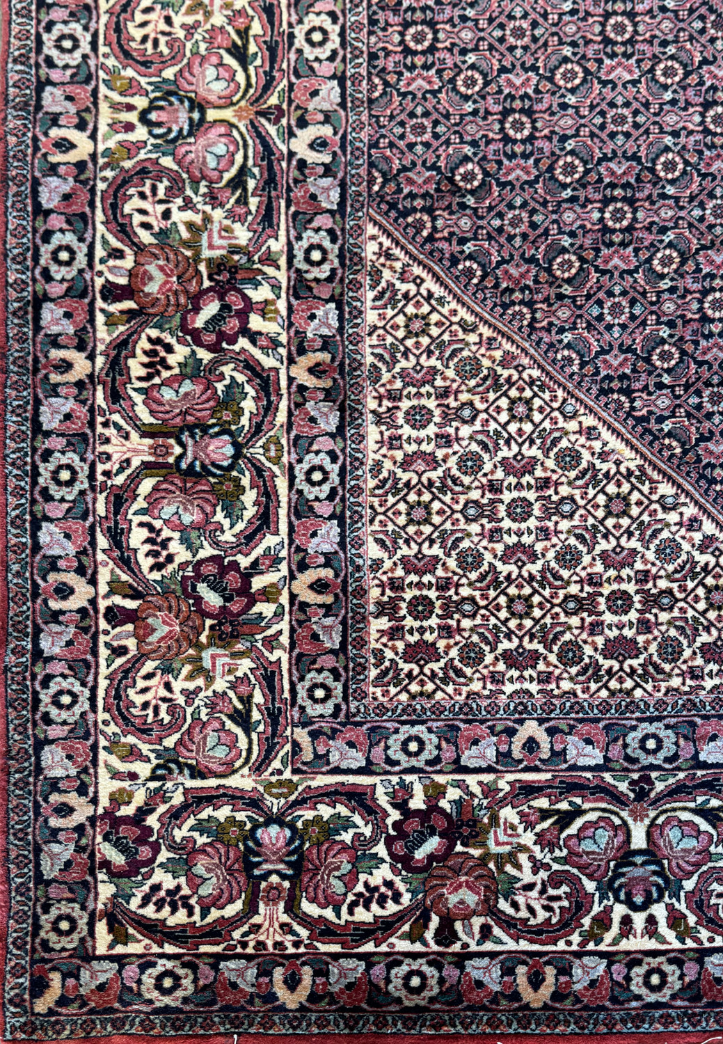 Another angle highlighting the side border of the 11'6x11'6 Persian Bijar square rug, capturing the density of the weave and the vivid interplay of colors