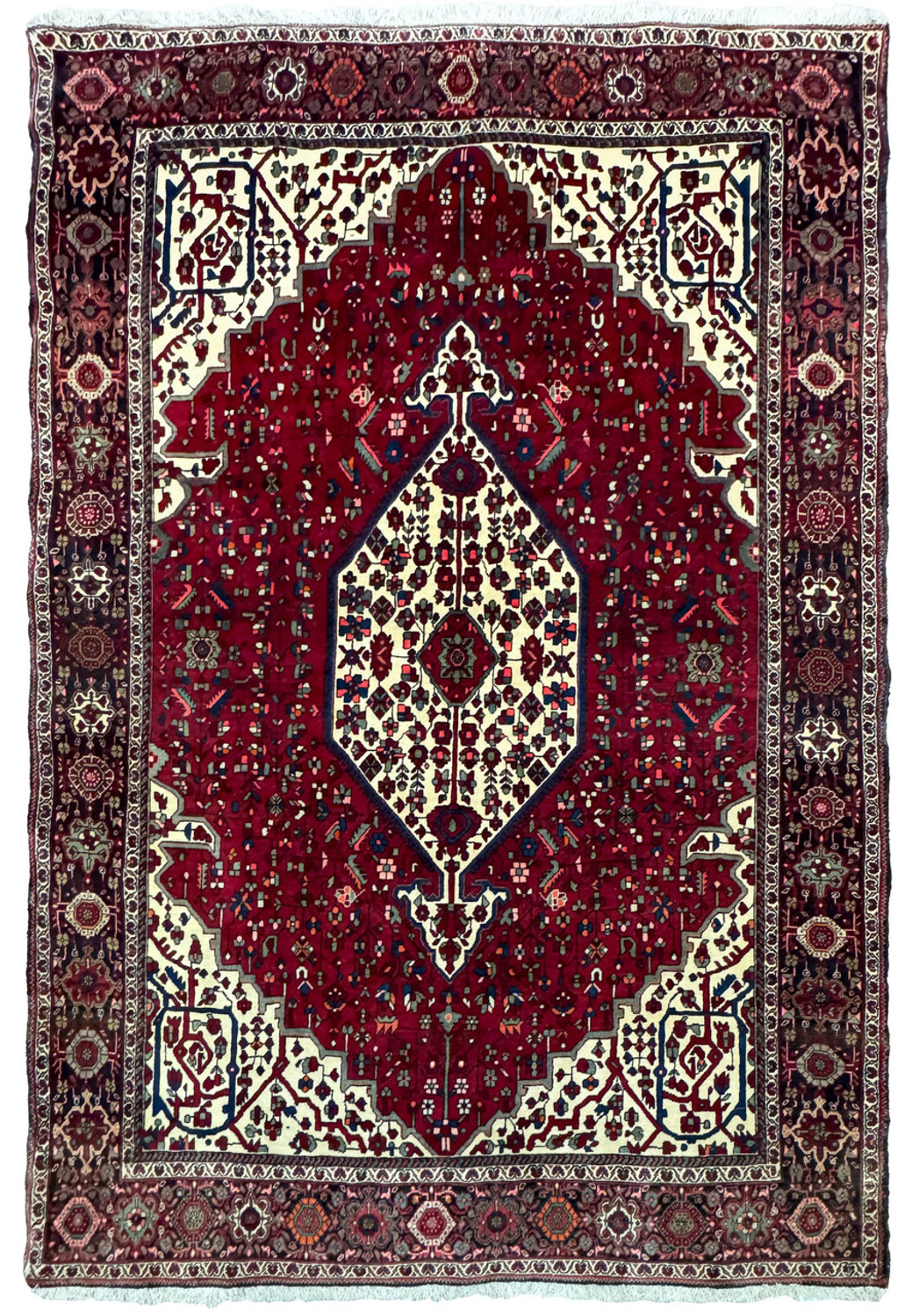 Overhead view of a 4'7" x 6'7" Persian Qum Kork rug featuring a rich red field with a central floral medallion and intricate cream border