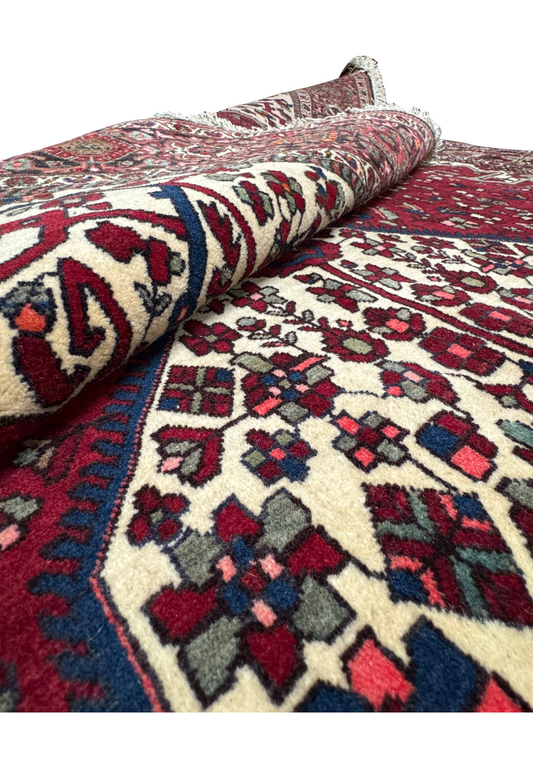 Zoomed-in view of the Persian Qum Kork rug’s ornate border, featuring a complex series of floral and geometric motifs